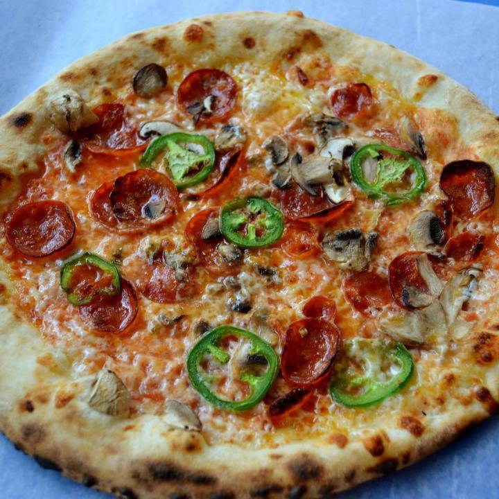 The dragon pizza: Pomodoro, Fresh Mozzarella, Pepperoni, Crimini Mushrooms, and Jalapenos - The Urban Oven